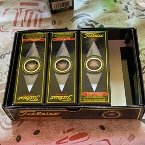 Titleist NXT Tour Golf Balls in Black and Yellow Box